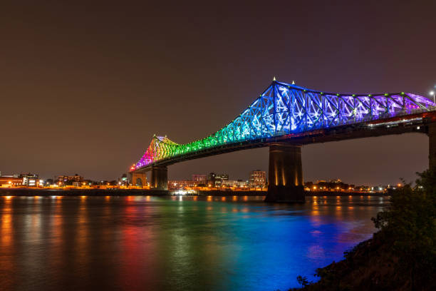 istock Jacques Cartier Bridge in a rainbow lighting at night. Montreal 1341563598