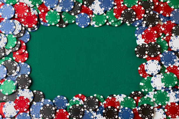 istock Pile of Casino pocker gambling chips on green table 1341564411