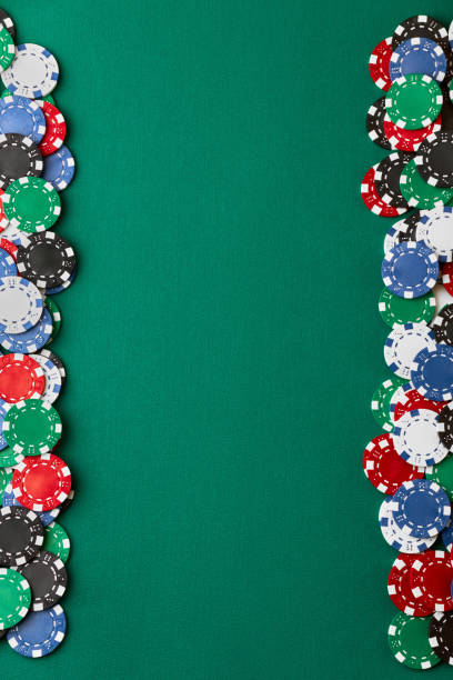 istock Pile of Casino pocker gambling chips on green table 1341564426