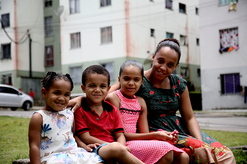 mata de sao joao, bahia, brazil - october 1, 2020: a mother and her three children are seen in a popular condominium under construction by the federal government in the city of Mata de Sao Joao.
