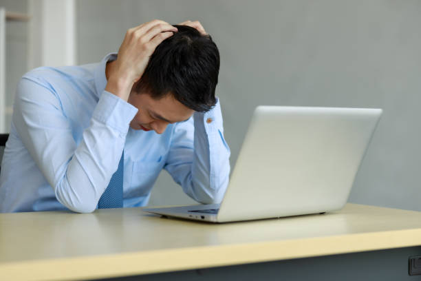 istock portrait asian businessmann stressed for working project plan deadline in office 1341575225