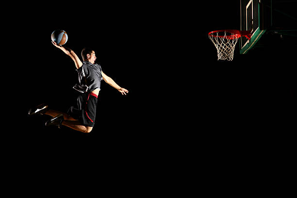 istock Basketball jump  dunk - isolated on black background 134157680