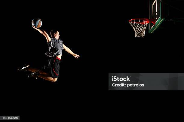 Basketball Jump Dunk Isolated On Black Background Stock Photo - Download Image Now