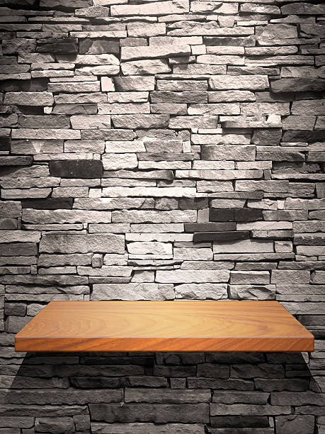 istock Wood shelf on stone wall 134157909