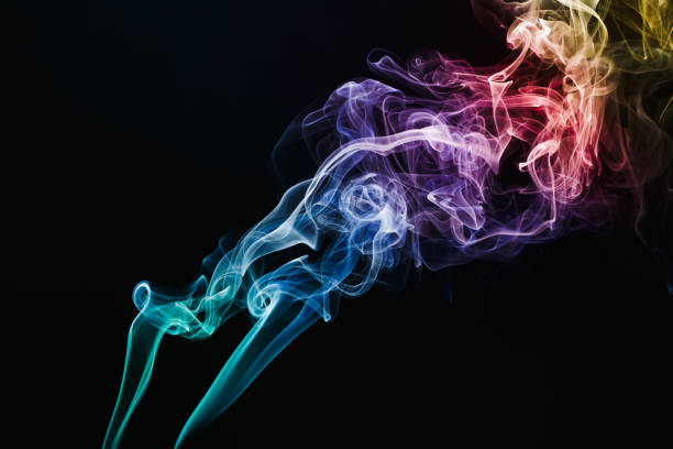 istock Smoke colorful floating on dark background 1341580051