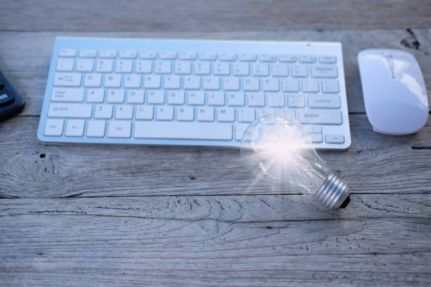 istock Idea innovation and inspiration concept. illuminated light bulb on wooden table, concept creativity with bulb that shine glitter. Inspiration of ideas for sustainable business development 1341581163