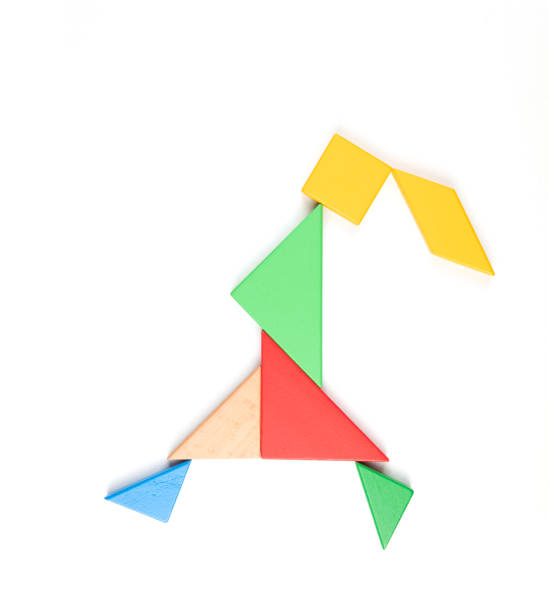 istock Tangram Puzzle Walking Girl on White Background 1341583129