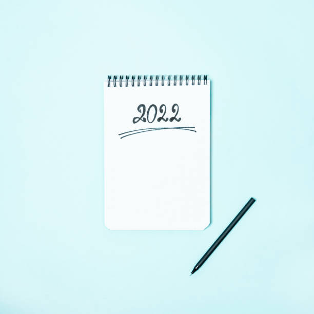 istock Top view of empty notebook ready for New 2022 Year resolutions or wish list 1341584715