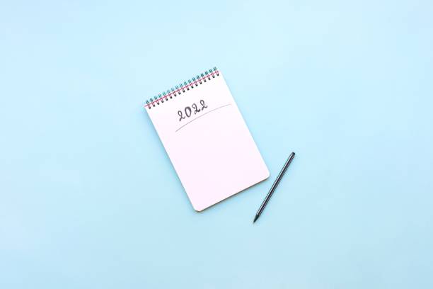 istock Top view of empty notebook ready for New 2022 Year resolutions or wish list 1341584817