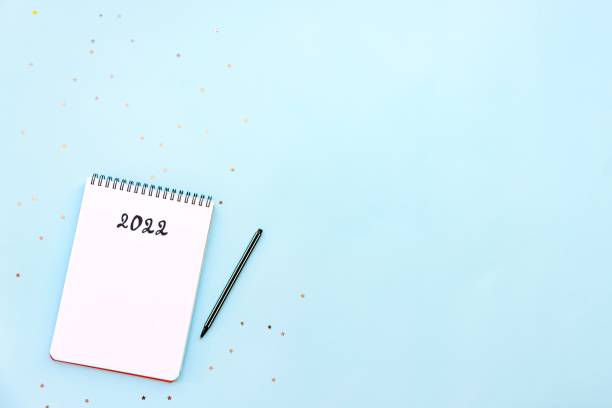 istock Top view of empty notebook ready for New 2022 Year resolutions or wish list 1341584822