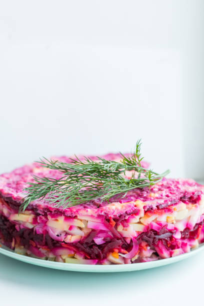 istock Russian salad ,Herring under fur coat. traditional herring salad with beetroot, carrot, eggs,potatoes and beet on ceramic plate .Holiday salad of Russian cuisine. 1341589627
