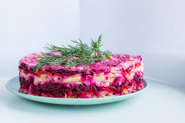 istock Russian salad ,Herring under fur coat. traditional herring salad with beetroot, carrot, eggs,potatoes and beet on ceramic plate .Holiday salad of Russian cuisine. 1341589630