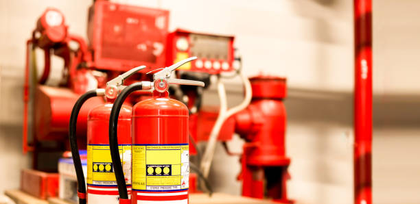 istock The red fire extinguisher is ready for use in case of an indoor fire emergency. 1341589704