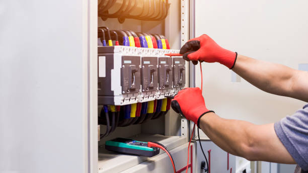istock Electrical engineer tests the operation of the electric control cabinet on a regular basis for maintenance. 1341589811