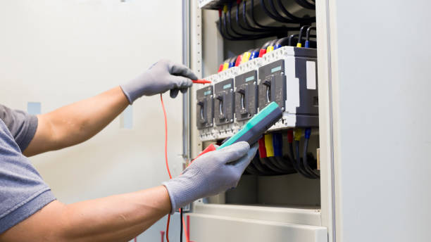 istock Electrical engineer tests the operation of the electric control cabinet on a regular basis for maintenance. 1341590397