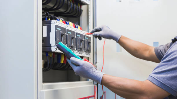 istock Electrical engineer tests the operation of the electric control cabinet on a regular basis for maintenance. 1341590399