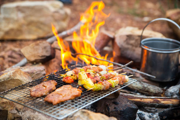 istock BBQ / Steak Meat Roast on a natural fire Camping atmosphere. Relaxing time camping on a mountain. Activity in holiday concept. 1341590534