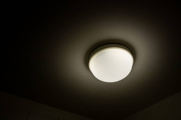 istock Hemispherical lighting that shines on the ceiling in the dark room 1341592301