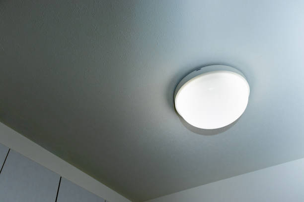 istock Hemispherical lighting that shines on the ceiling of a dim room 1341592303