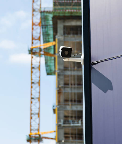 istock Security camera on the wall of modern office building 1341593066