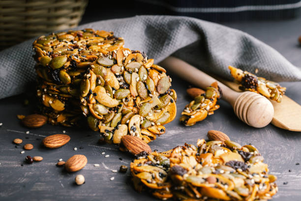 istock Healthy sweet dessert snack. Cereal granola bar with nuts 1341593871