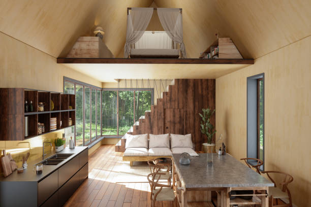 Tiny House Interior With Sofa, Kitchen, Dining Table, Bedroom And Garden View From The Window. Tiny House Interior With Sofa, Kitchen, Dining Table, Bedroom And Garden View From The Window. prefabricated building stock pictures, royalty-free photos & images