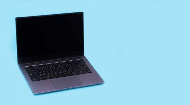 istock laptop on a blue background with a copy space 1341594952
