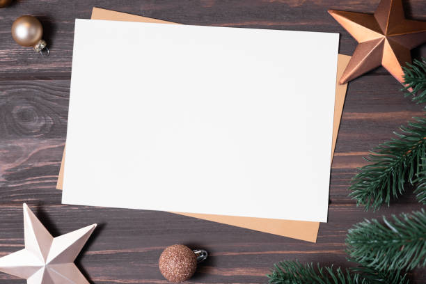 istock Merry Christmas greeting card with empty space for holiday text on wooden table. 1341597659
