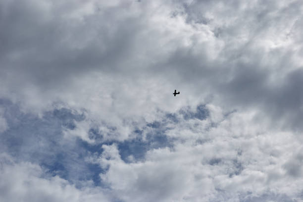 Free Stock Photo of Small Airplane Flying Through Cloudy Sky | Download ...