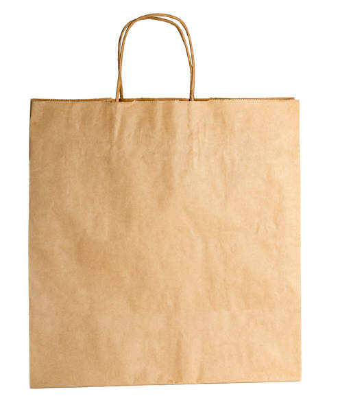 istock Paper bag close up isolated on white background. Environmental packaging, protecting the environment from harmful waste, 1341598116