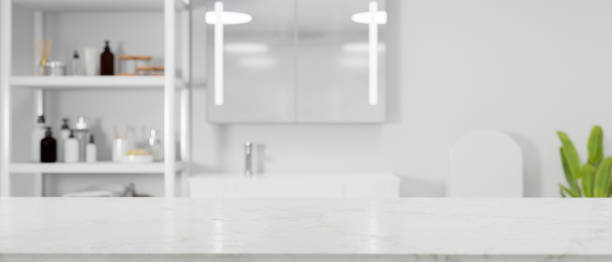 istock White minimalist empty marble tabletop for montage over modern bright bathroom interior 1341599031