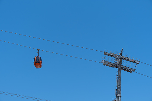 Ski lift. cable car poles. reels on pole. Aerial lift pylon.