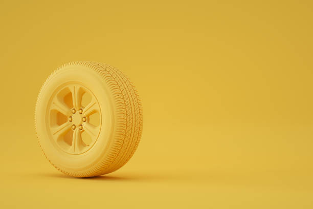 istock Car Wheel on Yellow Background 1341599224