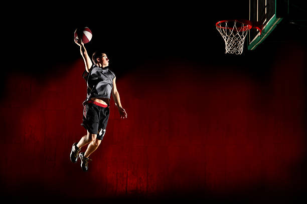 istock Basketball jump - isolated on red background 134160169
