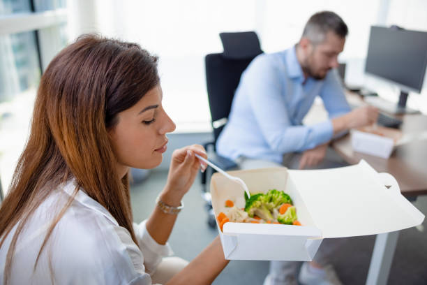 istock Coworkers  having lunch with take out at the office 1341609434
