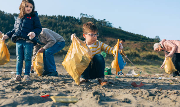 istock Volunteers cleaning the beach 1341613080