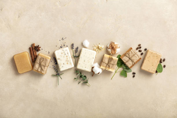istock Handmade organic soap bars and ingredients on natural stone background, flat lay 1341614092