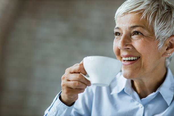 istock Portrait of senior woman drinking coffee. 1341616708
