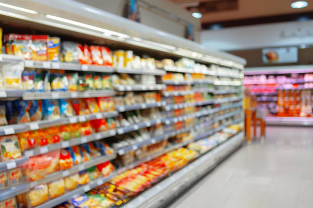 istock Abstract blurred supermarket shelves with products for background 1341617273