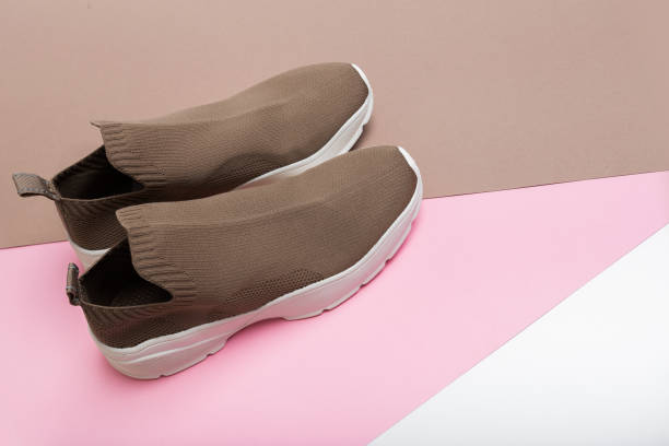 istock modern beige sneakers with white soles on multicolour background 1341618832