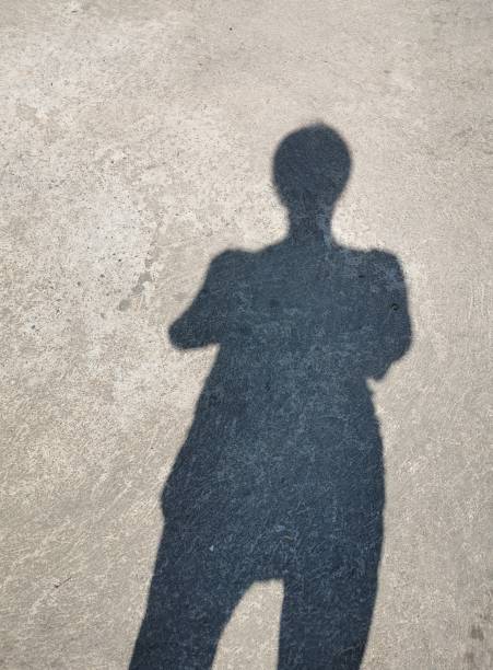 istock Shadow of people on the cement floor 1341621131