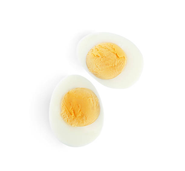 istock Halves of fresh hard boiled chicken egg isolated on white, top view 1341621647