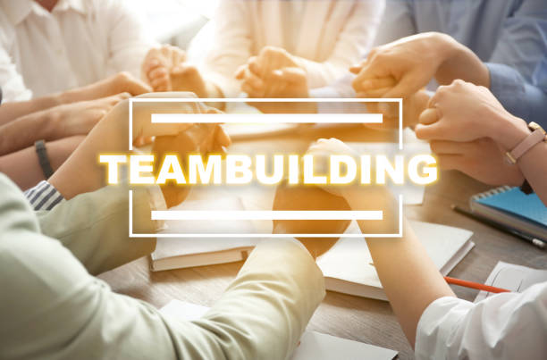 istock People holding hands together at table. Teambuilding concept 1341621684
