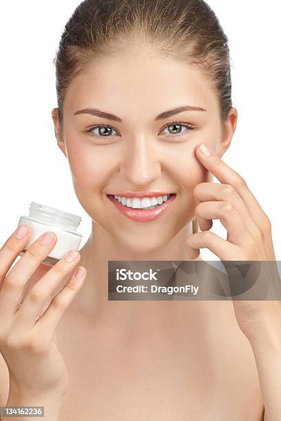 Beautiful Woman Applying Moisturizer Cream Stock Photo - Download Image Now - Applying, Moisturizer, Adult