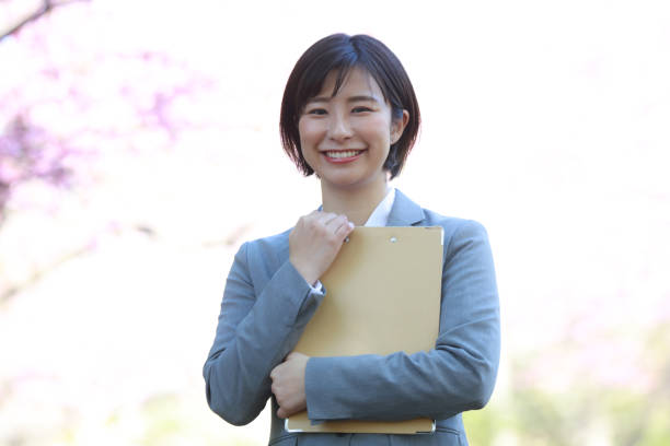 istock Female employee with binder 1341622504