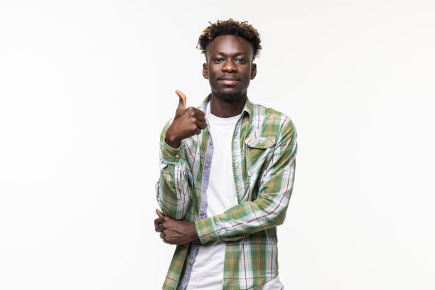 istock Handsome african showing thumbs up against white background 1341624186