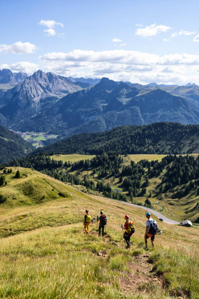 istock Alpine mountain guide climbing with family hiking group 1341627504