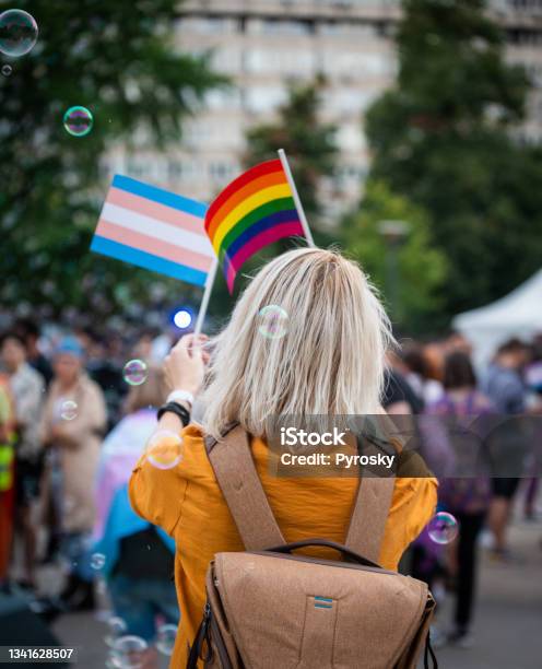 Woman Waving Rainbow Pride Flags At The Love Festival Stock Photo - Download Image Now