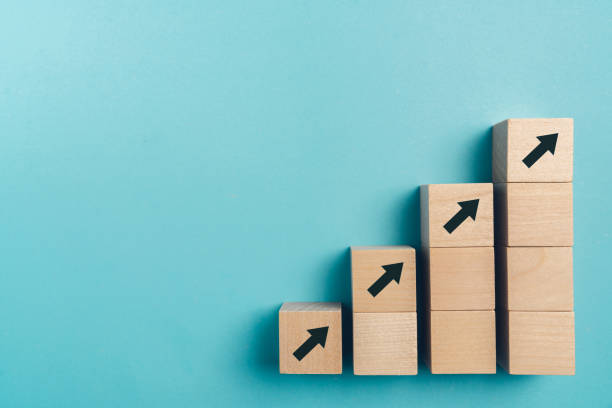 istock Business growth concept , wood block stacking as step stair on paper blue background, copy space. 1341628919