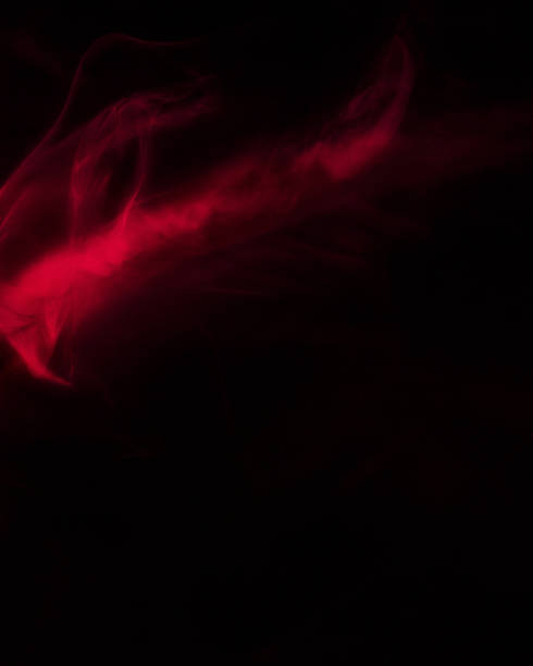Close up of a smoke cloud. Close up picture of a smoke cloud, shot in studio with colorful lighting. lurie stock pictures, royalty-free photos & images